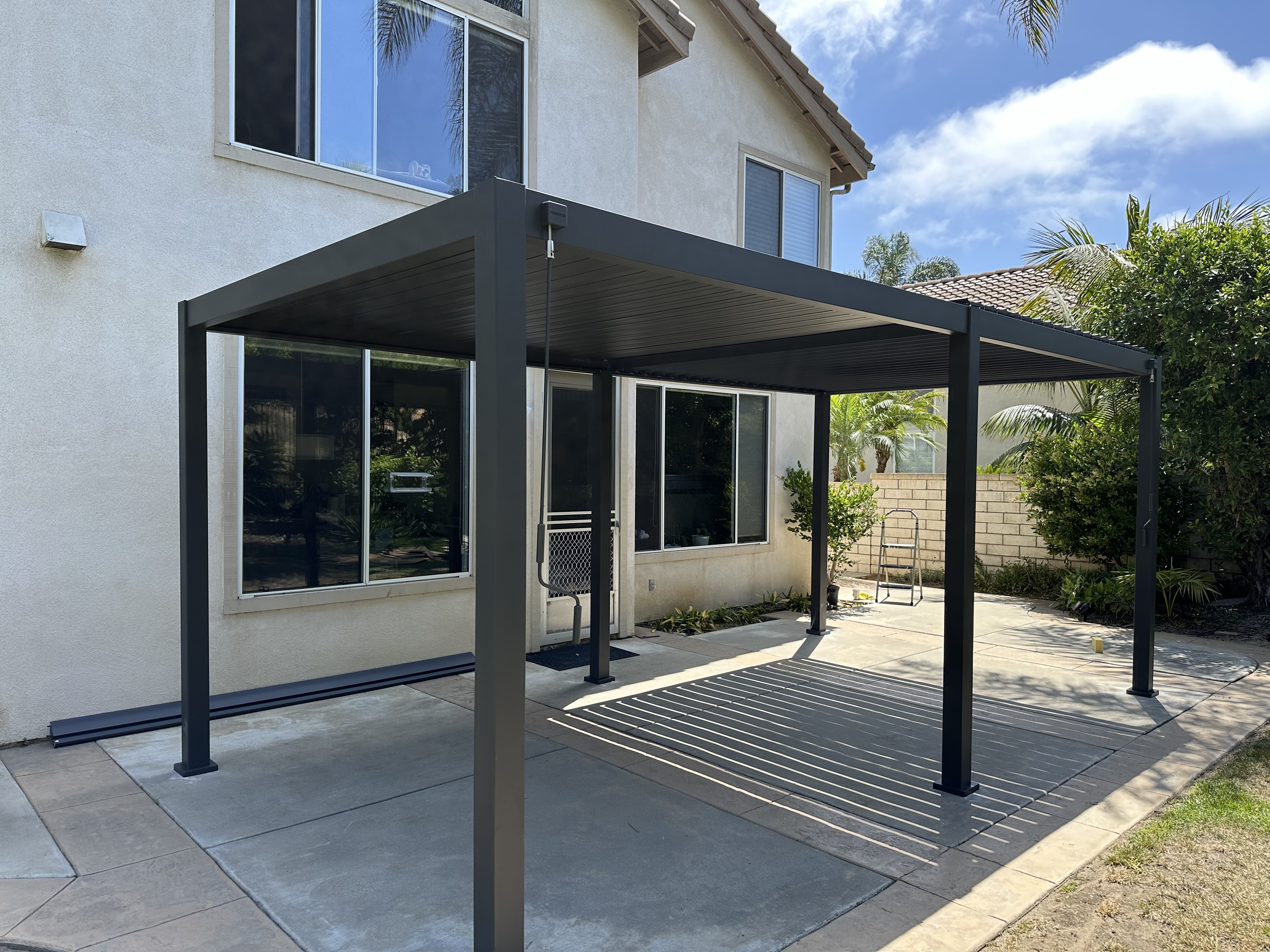 10x20 expansive aluminum louvered pergola front view